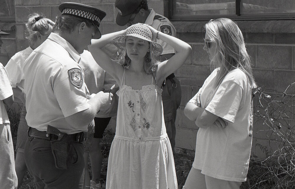 Protestors and police at the Look-At-Me-Now outfall protest, late 1991