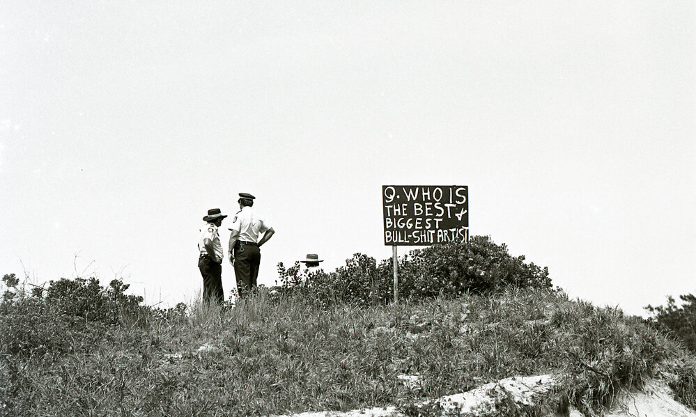 Police view the protest from afar, 25 November 1991