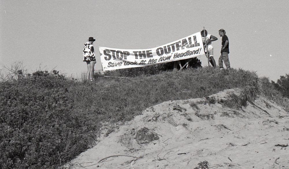 Signs against the ocean outfall, late 1991