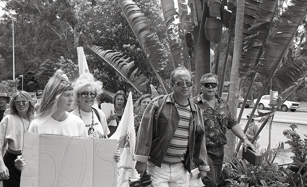 Alph Williams leads protestors meet outside the City Council's Administration building, late 1991