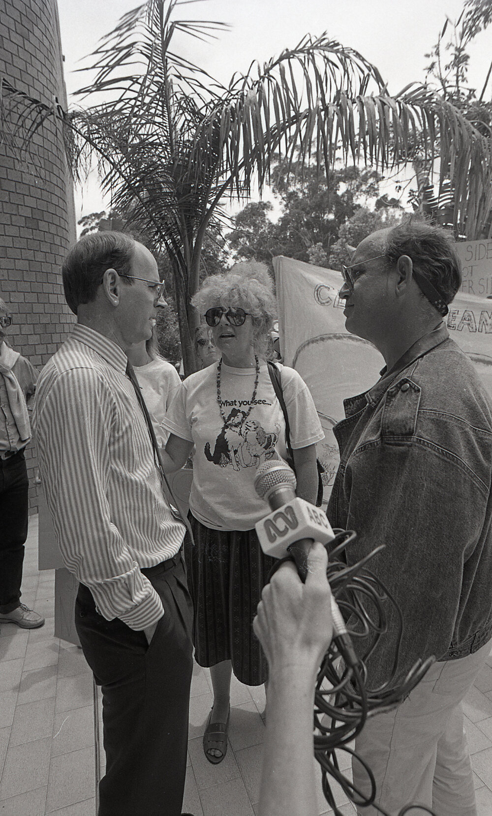 Alph Williams is interviewed by journalists outside the City Council's Administration building, late 1991