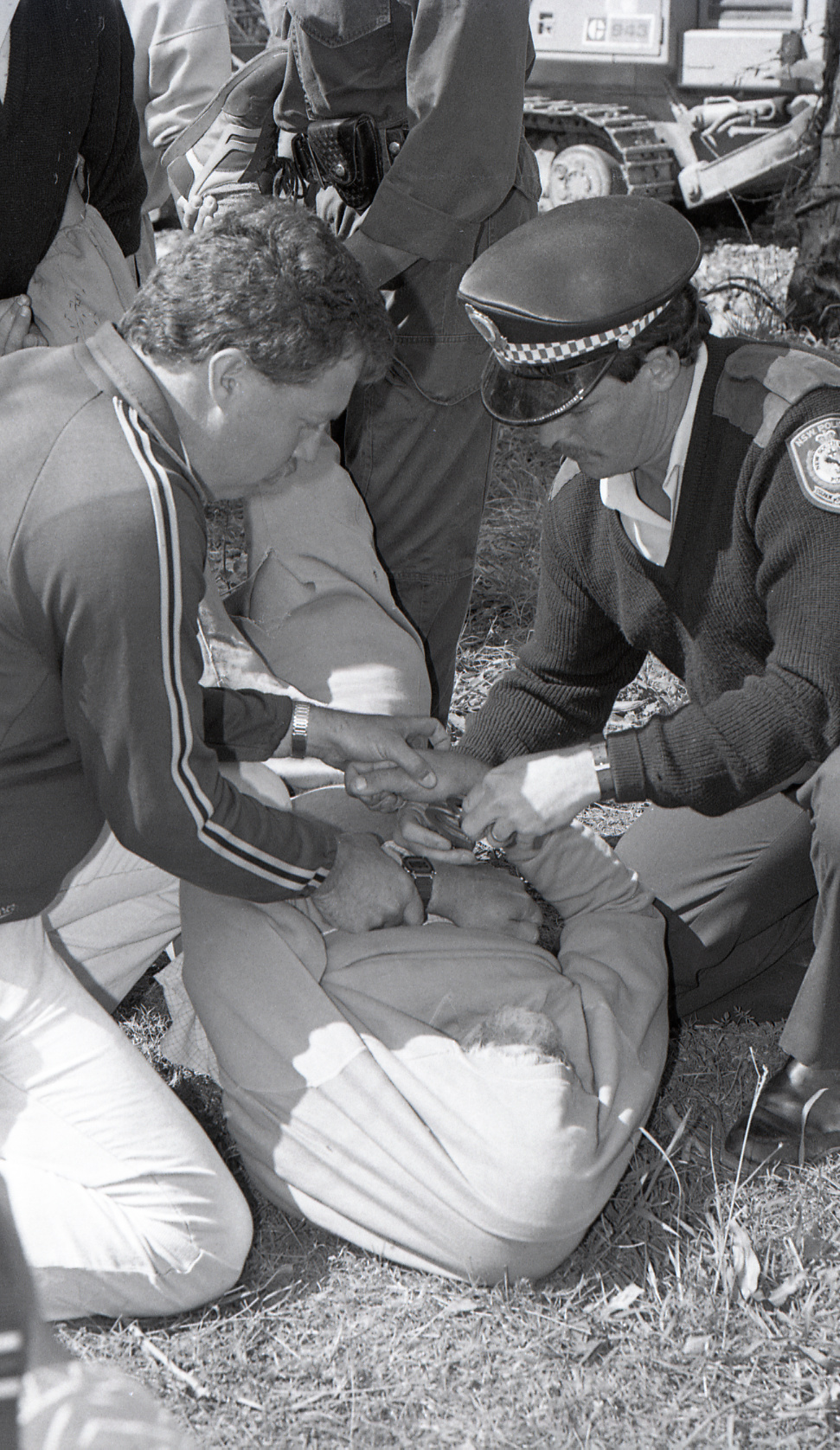 Police arrest a protestor, late 1991
