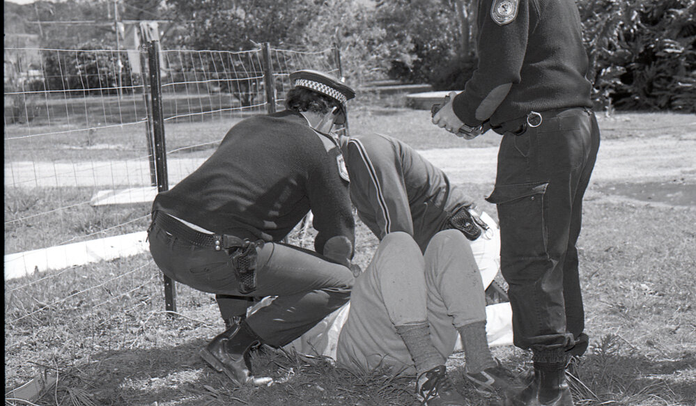 Police arrest a protestor, late 1991
