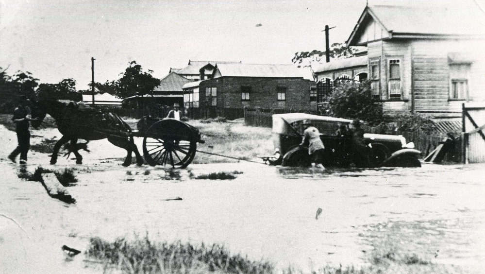 Dick Heskett rescuing Dr John Mulhearn's car from floodwaters, 1947 