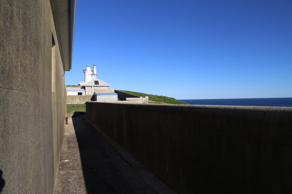 View of the lightkeepers' cottages and Lighthouse, 8 May 2019
