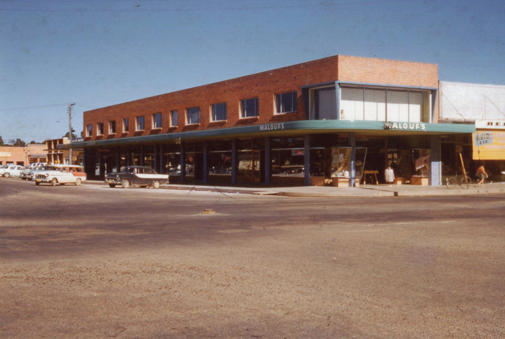 A silent cop stands alone after the parade has passed by, c.1960