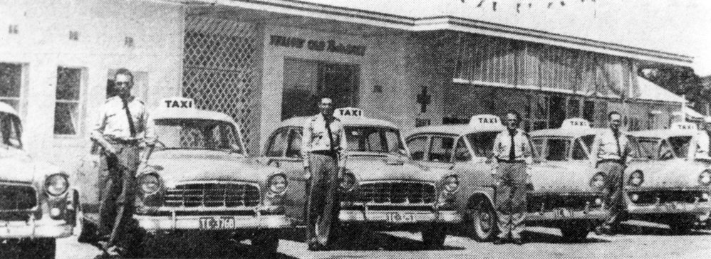 Radio-controlled yellow taxi cabs, December 1962