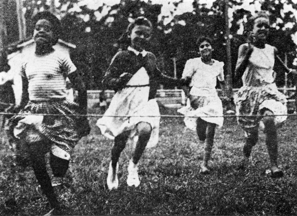 Races at the Christmas party, December 1958