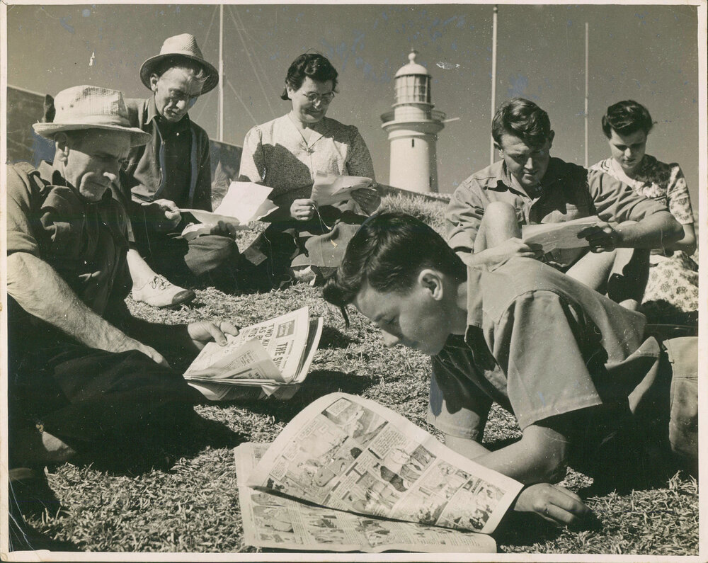 South Solitary Island lighthouse families devour the post and newspapers, 1946