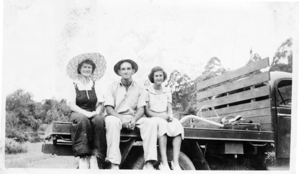 Jessica Hill with Tom Bishop and Noelene Lewthwaite on a farm truck, 1950