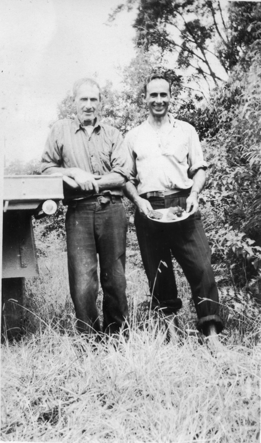 Chris Lewthwaite snr and jnr with pumpkin scones at Englands Road, 1950