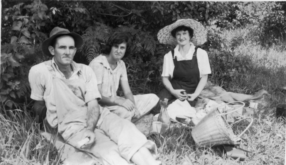 Tom Bishop with Noelene Lewthwaite and Jessica Hill in the pumpkin patch, 1950