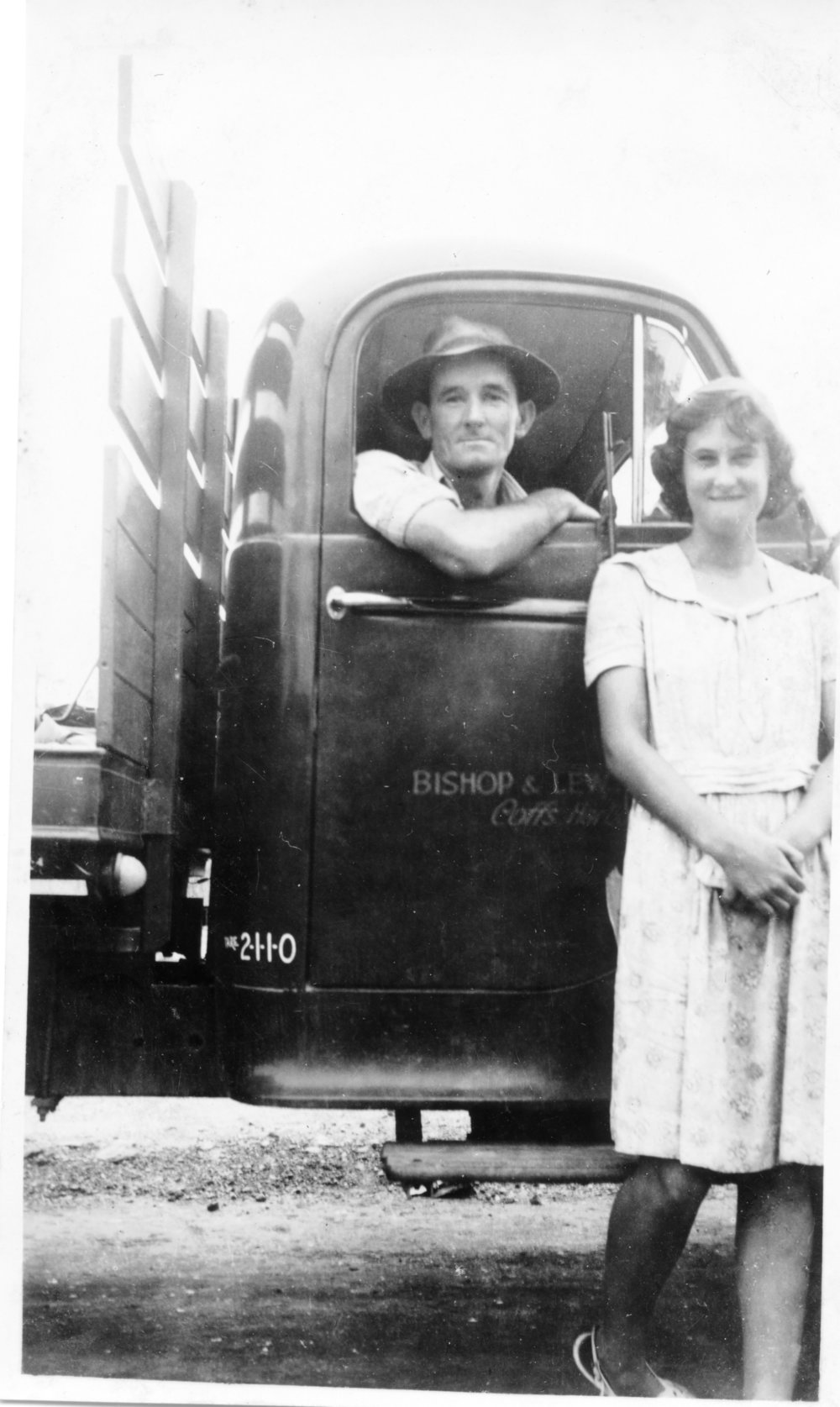 Tom Bishop and Noelene Lewthwaite with a farm truck, 1950
