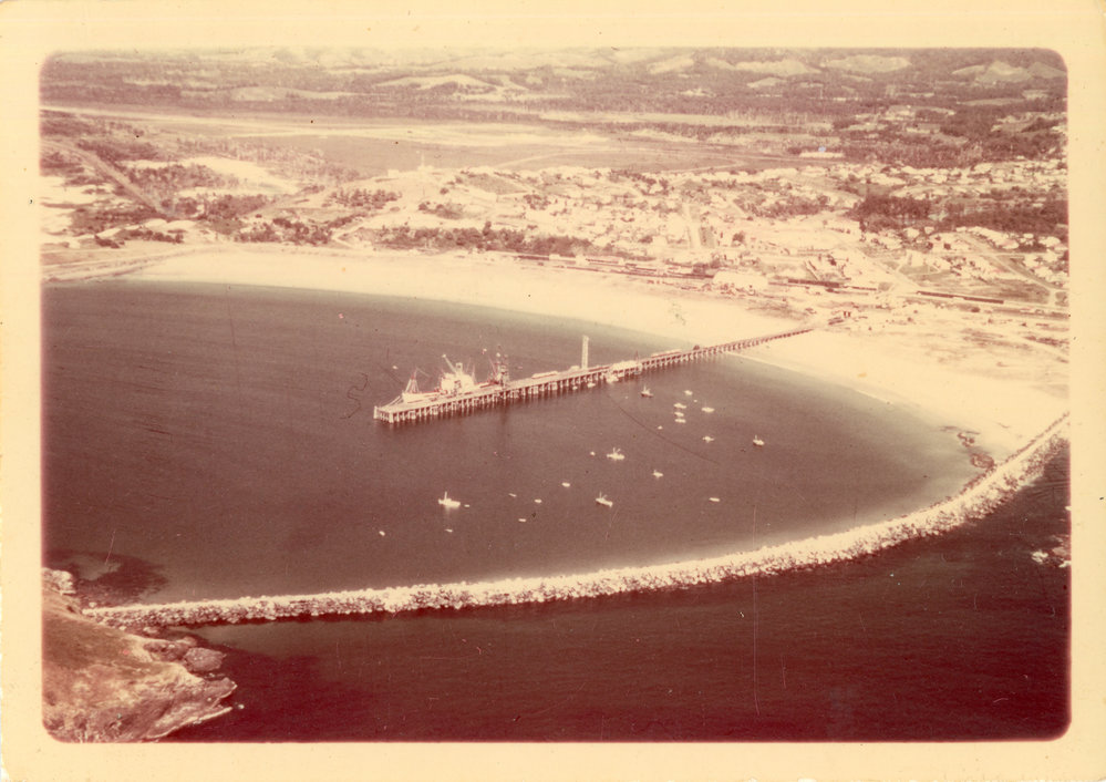 Aerial view of the jetty and northern breakwall in front of the airport, late 1970s