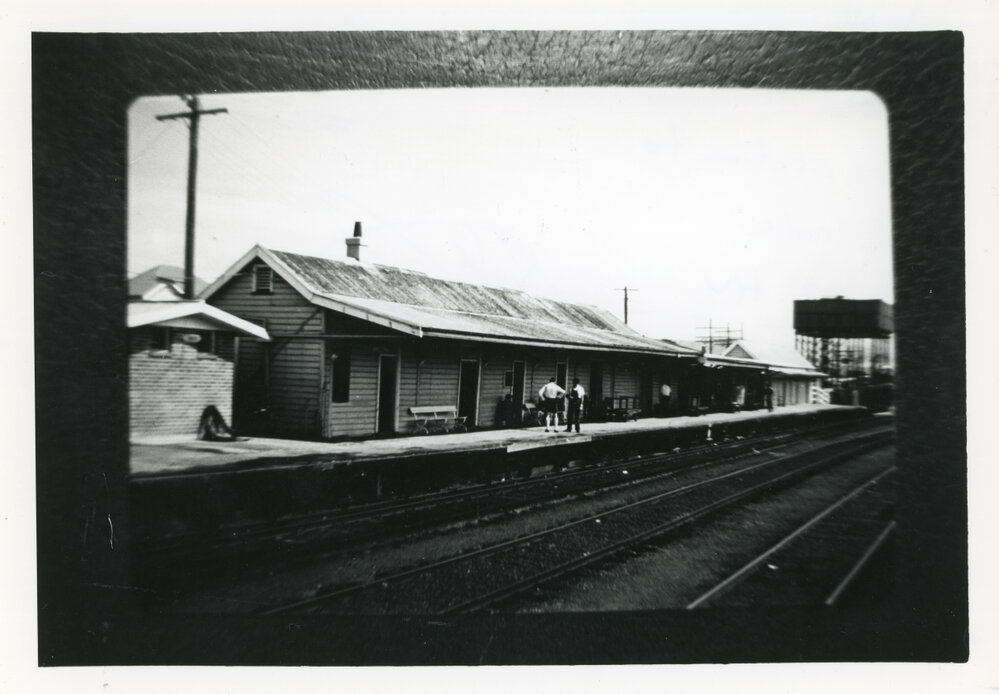 Ramshackle railway station and water tower, 1960s