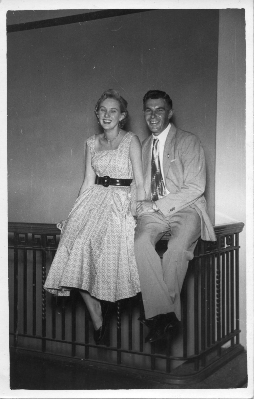Jim Worland and friend sitting on a stair rail in the old surf club