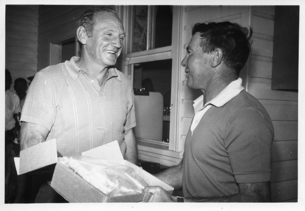 Jim Worland and Arthur Payne at a presentation held in the Deep Sea Fishing Club, 1970