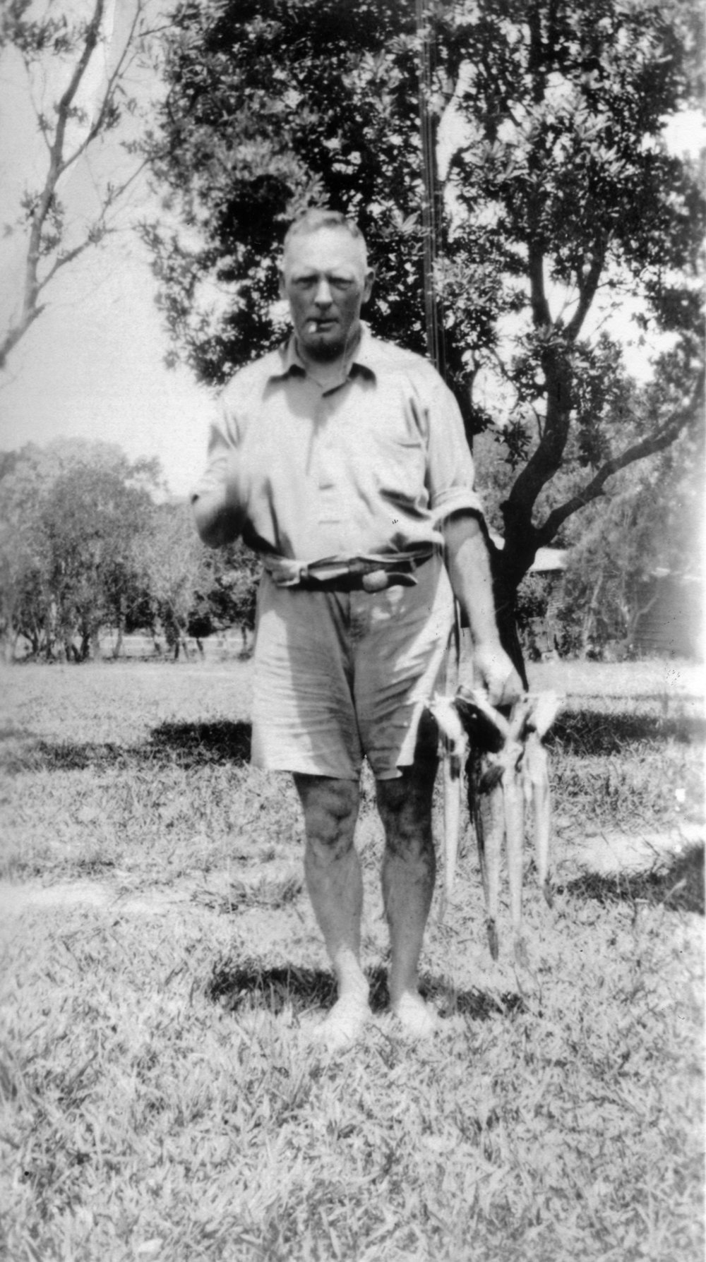 George Blakey with fish catch, 1933