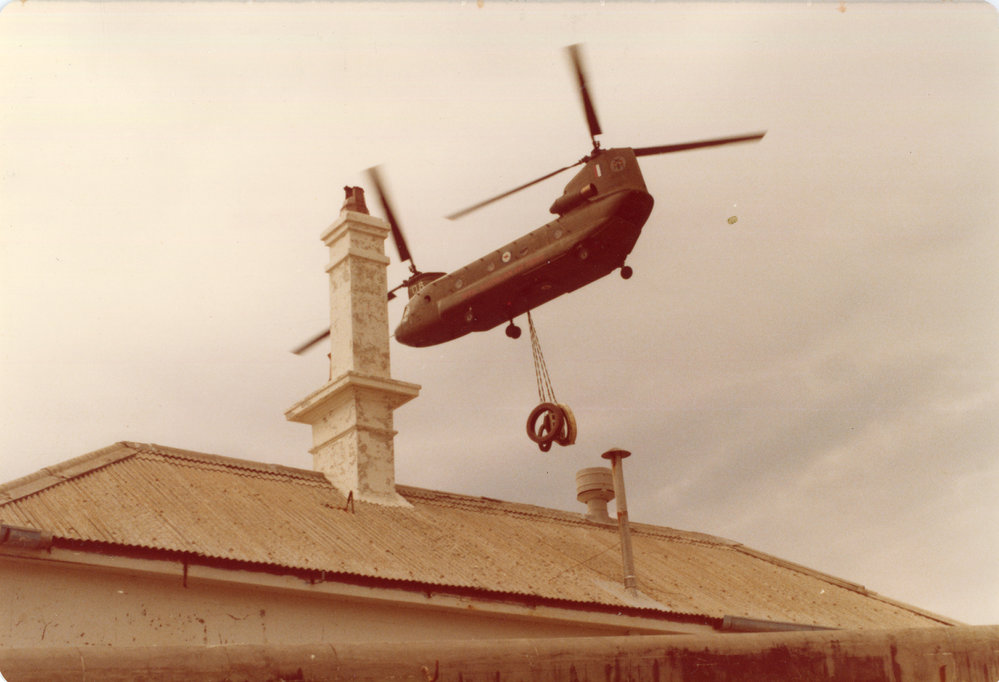 A Chinook helicopter lifts part of the South Solitary Island light, 7 September 1977
