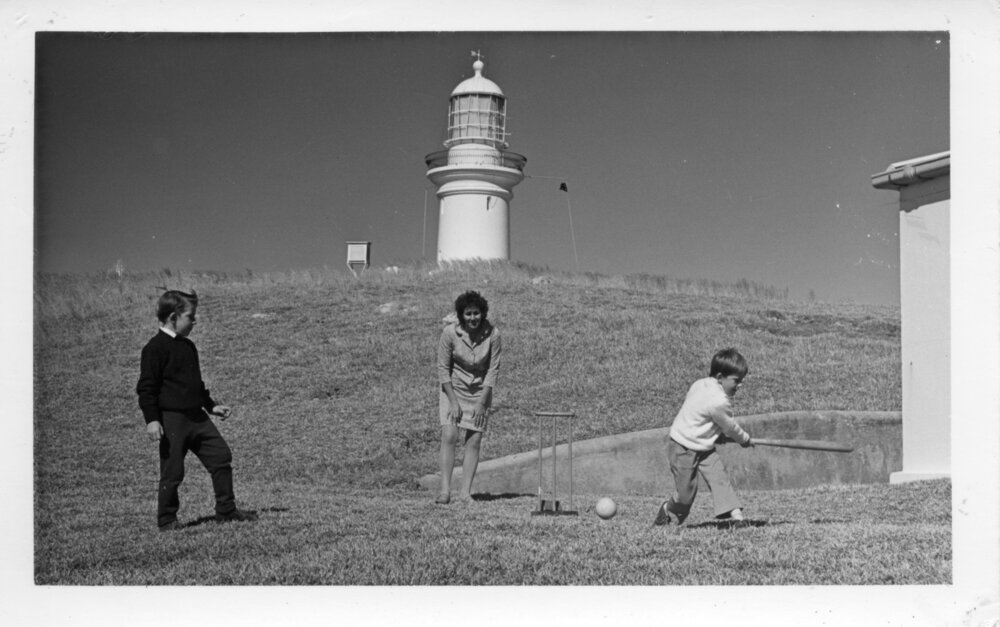 Pat Ross playing cricket with John and Mick Ross at South Solitary Island, early 1970s