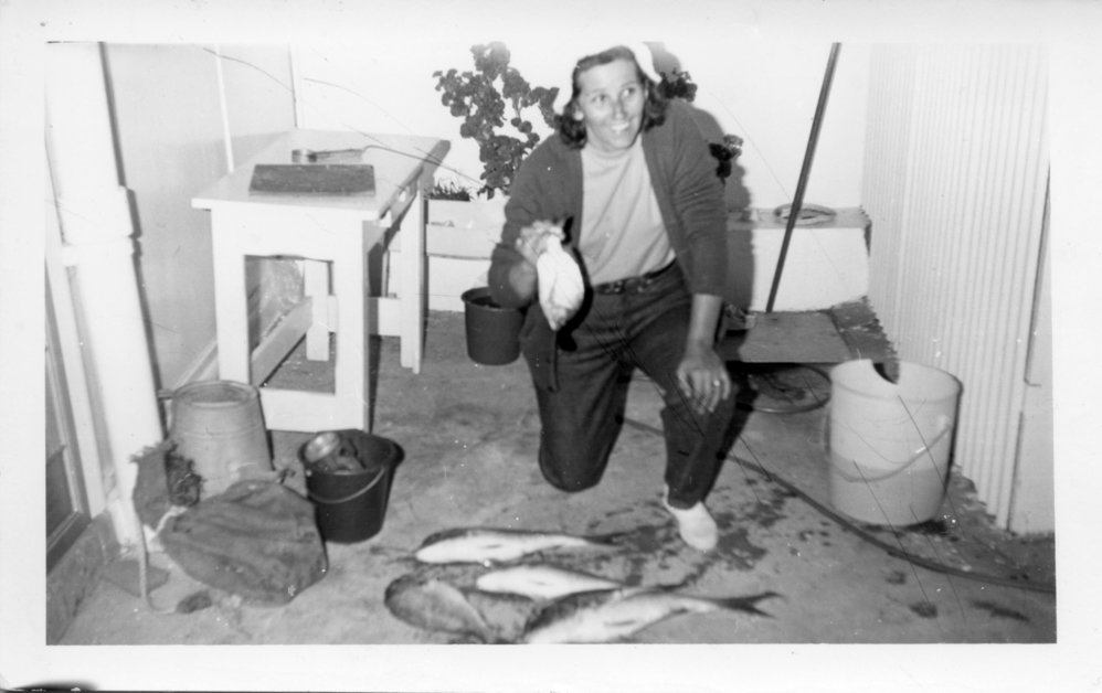 Pat Ross with her catch after a night of fishing, early 1970s