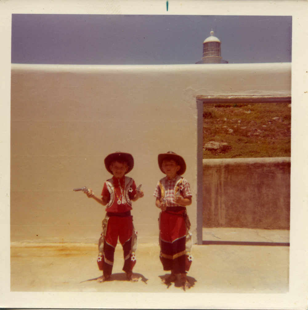 Mick and John Ross play cowboys on South Solitary Island, early 1970s