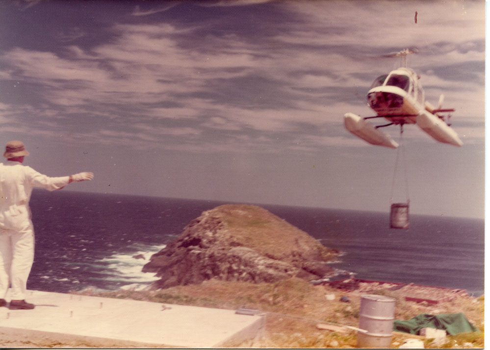 A helicopter delivers supplies to North Solitary Island, mid 1970s