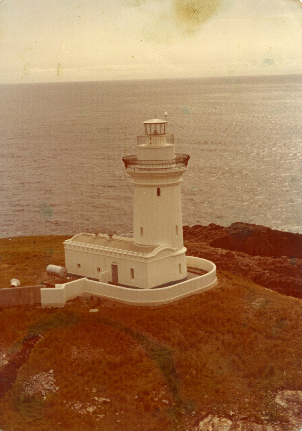 Helicopter view of the South Solitary Island's lighthouse, mid 1970s