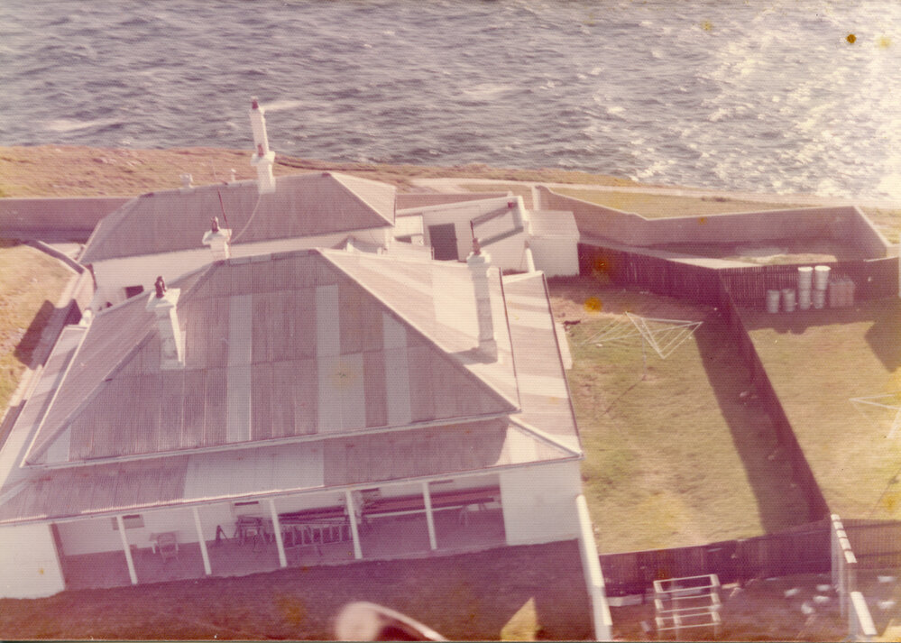 Helicopter view of the South Solitary Island's Headkeeper's cottage, mid 1970s