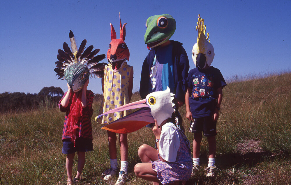 A group of children wearing masks