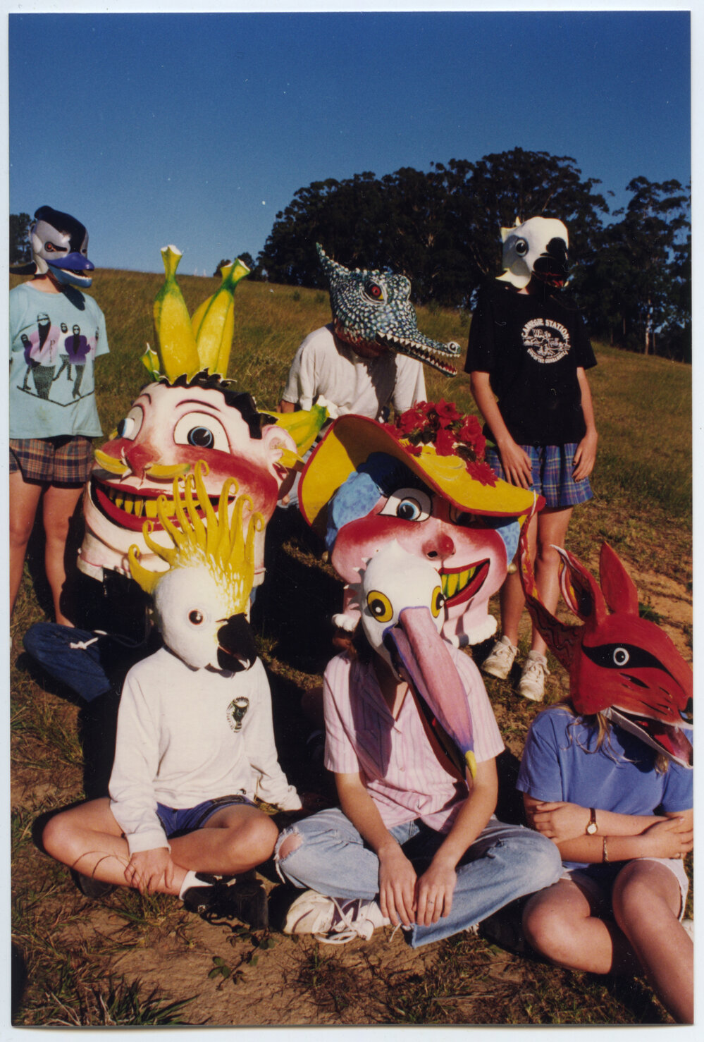 A large group of children wearing masks, 1996