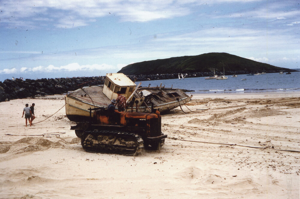 Fishing vessel washed up on Jetty Beach after a cyclone, 1956 - 1960