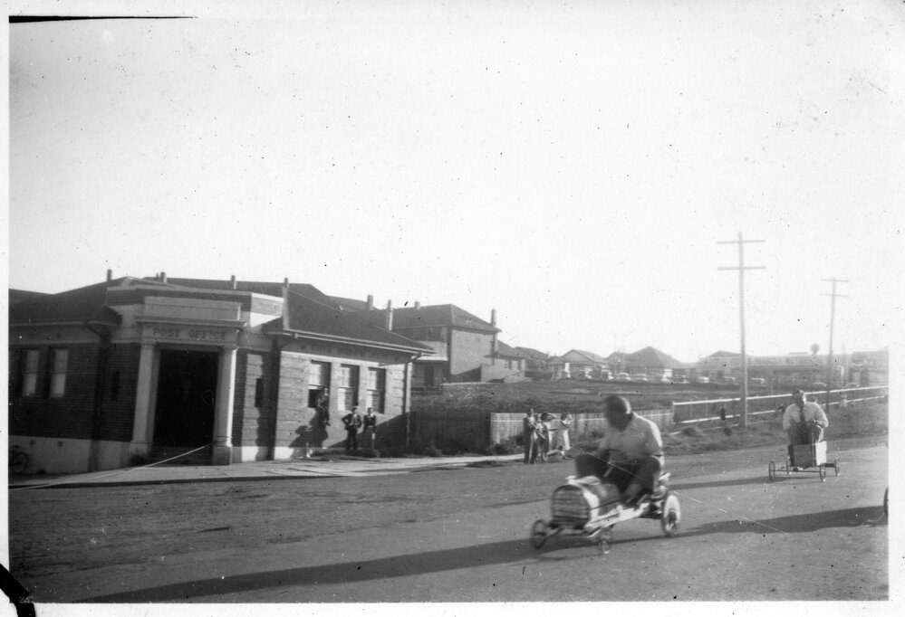 The Billy Cart Derby passes the Jetty Post Office, 21 October 1950