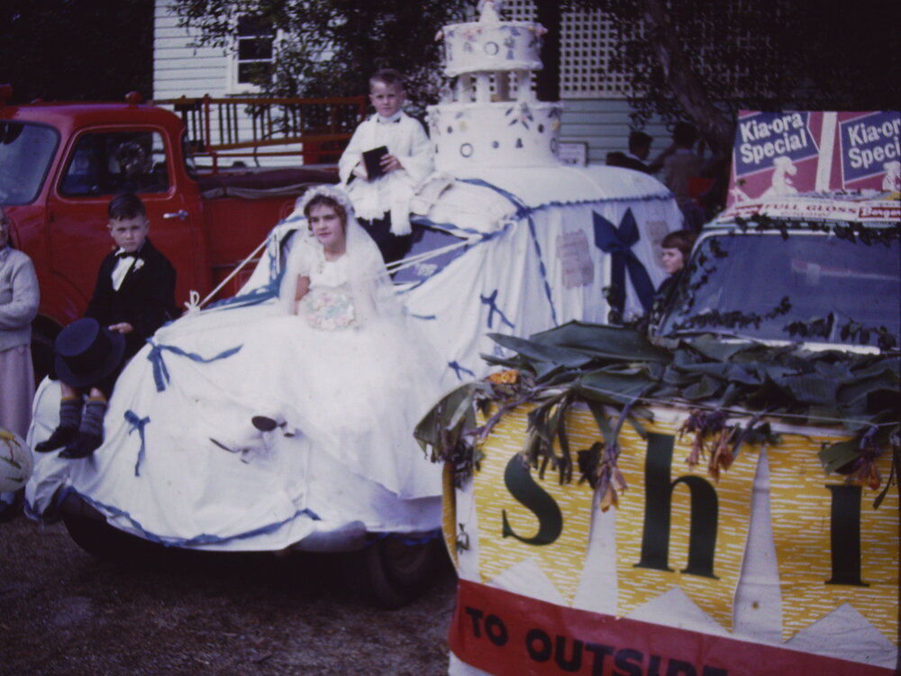 A wedding cake float in the Sawtell street parade, c.1960