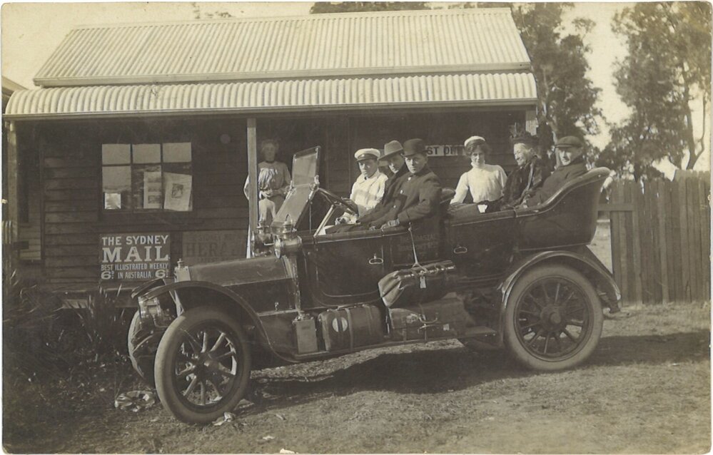 Picture postcard of passengers in a Coastal Transport Co. Ltd car, c. 1910