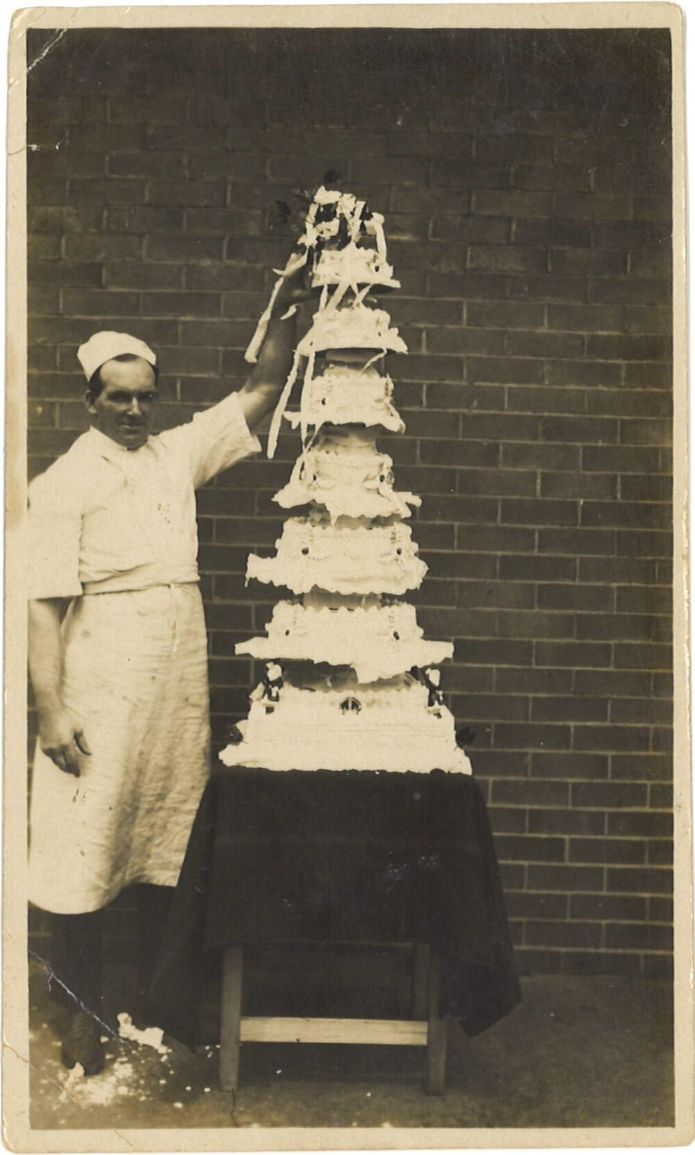 Cake and baker at Police Depot, Sydney, Christmas 1927