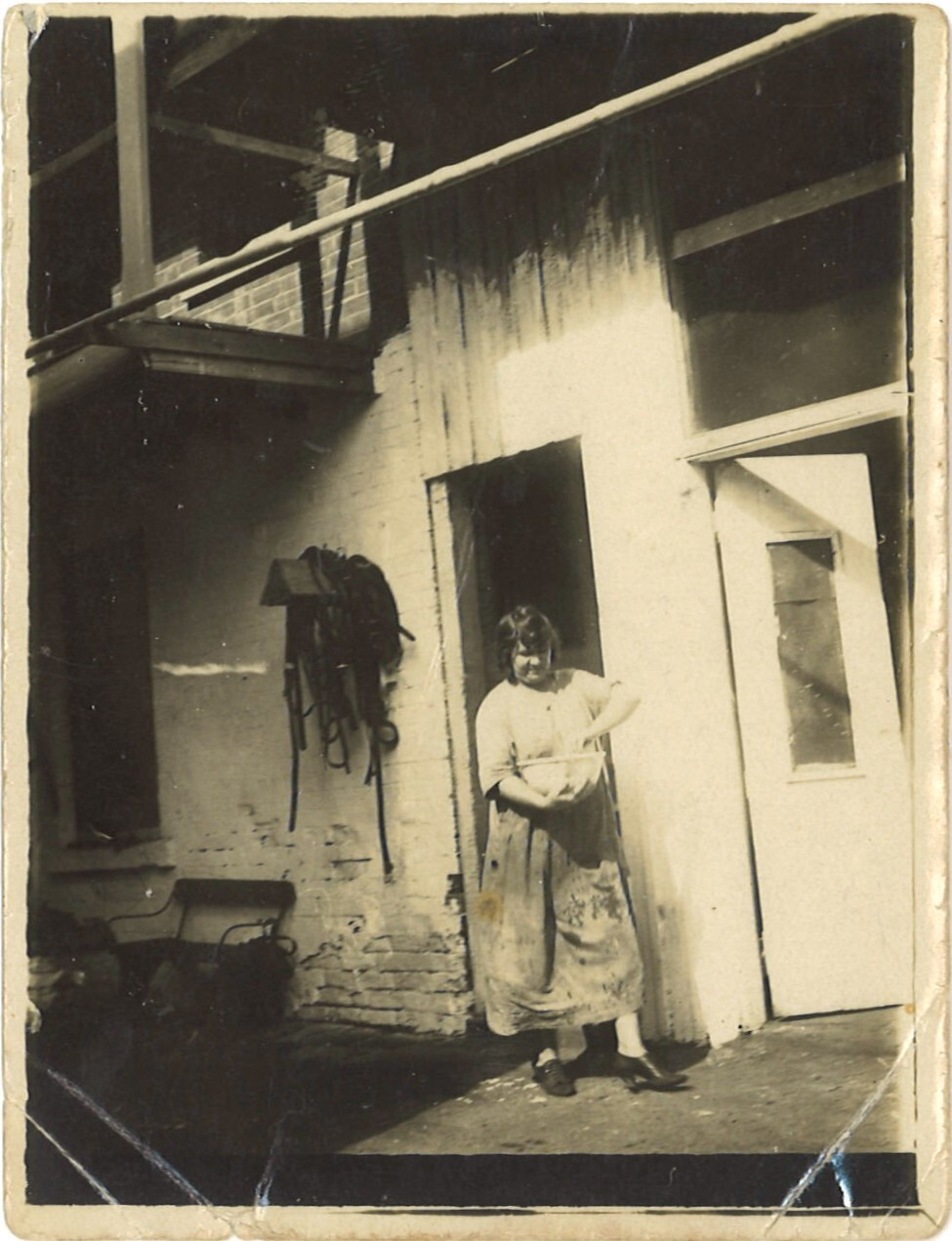 Woman outside a butchery, Karangi
