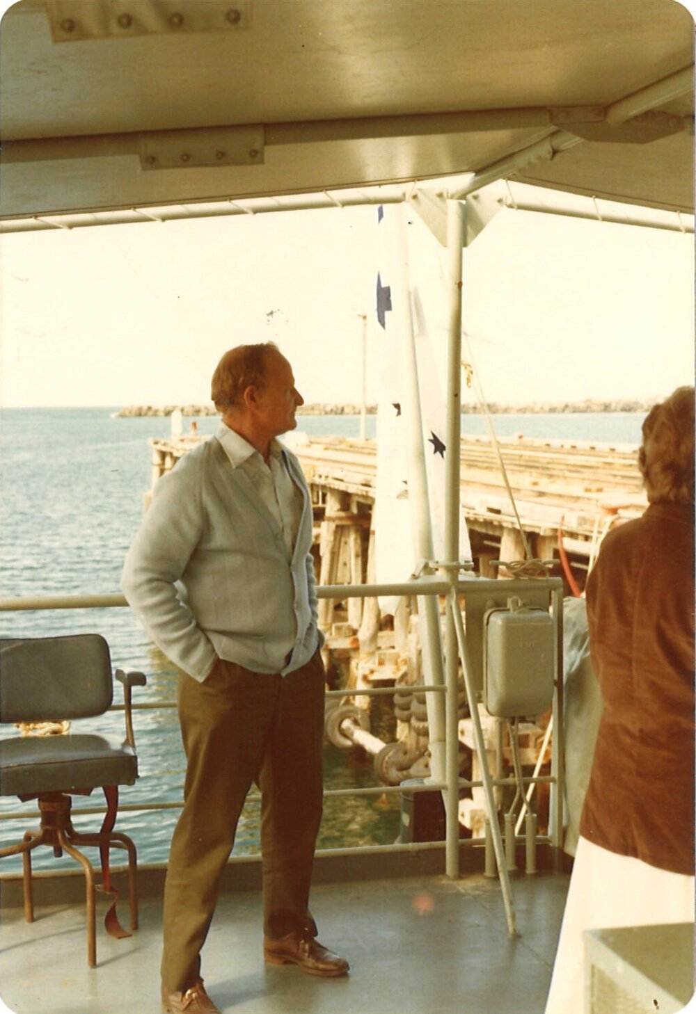 Man aboard a naval boat, Coffs Harbour Jetty, 1970s