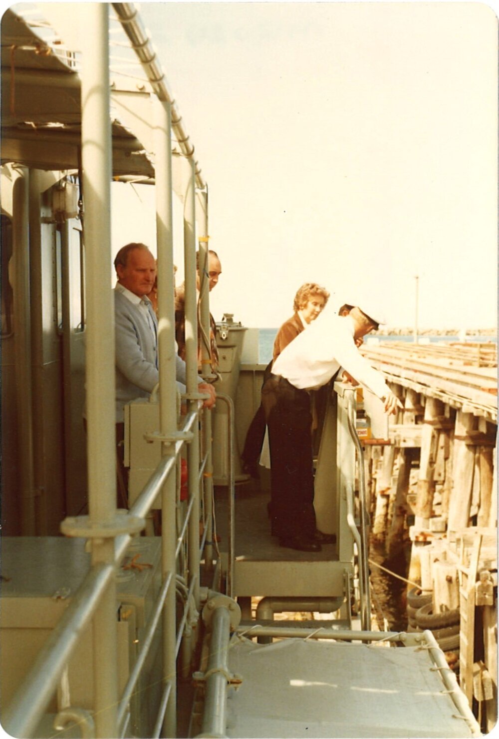 Man aboard a naval boat, Coffs Harbour Jetty, 1970s