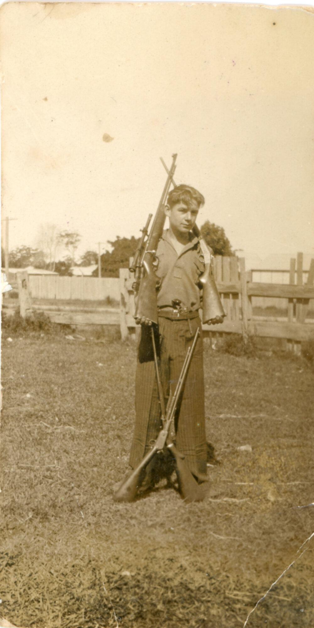 Donald Jack Glynn posing with firearms, 1935