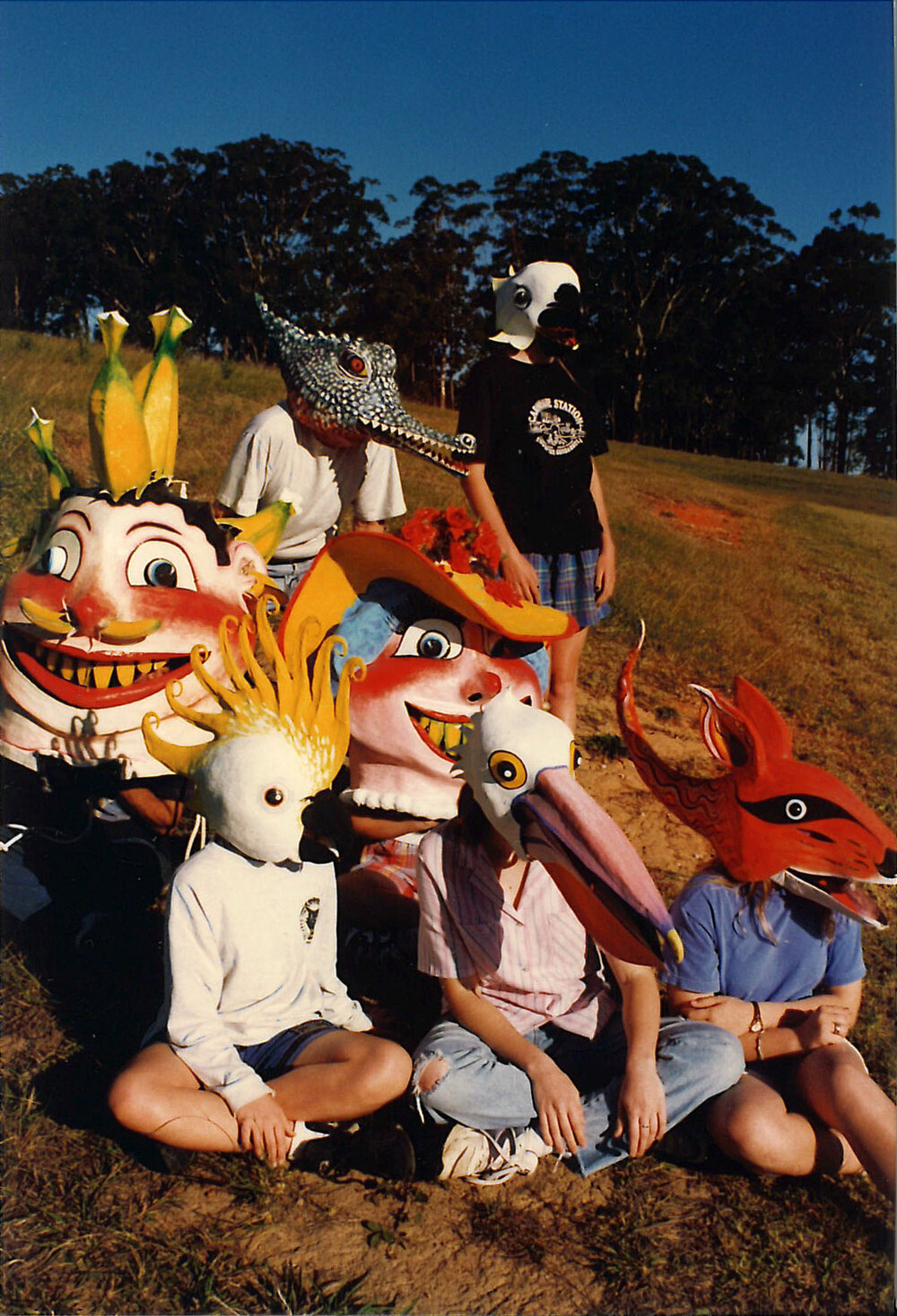 Large group of children wearing homemade masks, 1996