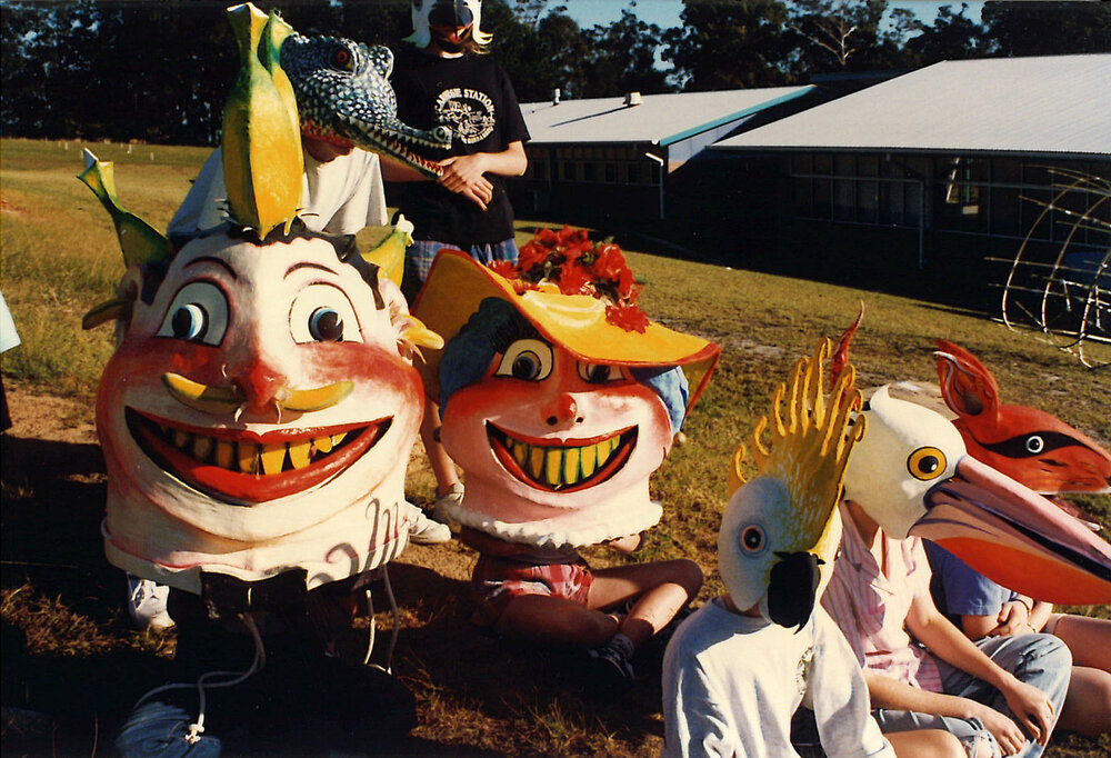Large group of children wearing homemade masks, 1996