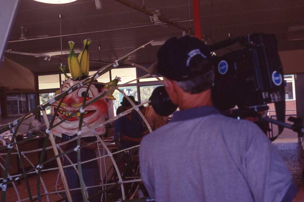 Film crew filming puppet making workshop