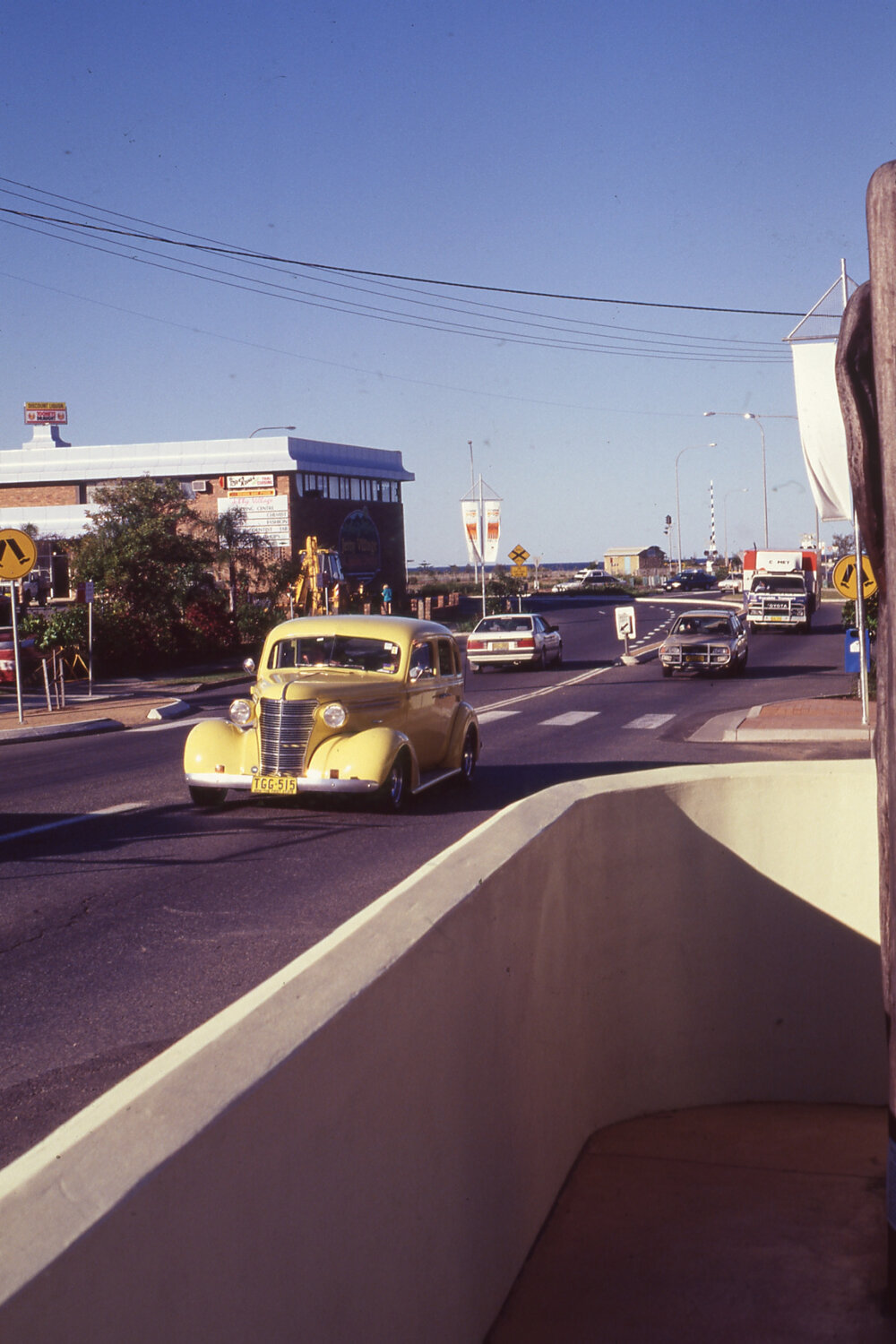 Classic car driving along Jetty Strip