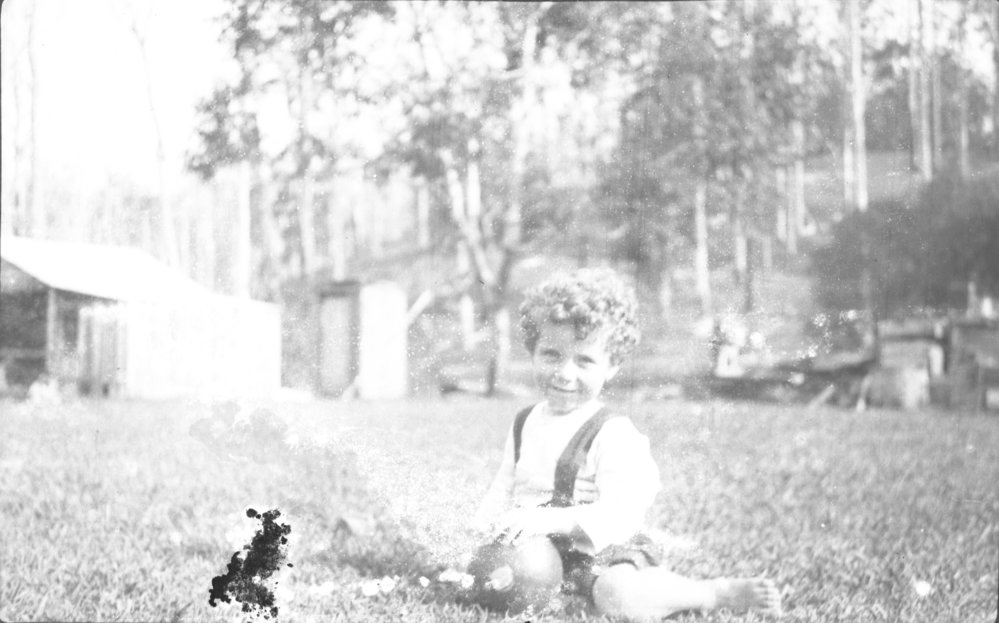 Toddler Jamie Hartley on the front lawn, 25 February 1923