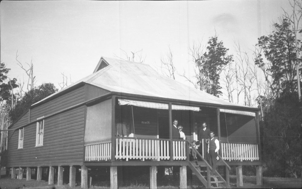 Julius Andersen and his wife standing on the verandah of their house 'Myuna', 28 May 1922