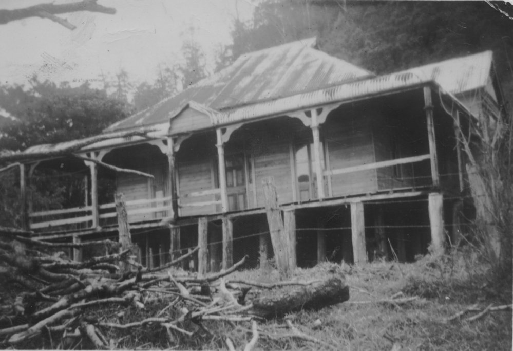 Weatherboard house with corrugated iron roof and verandah, July 1952 