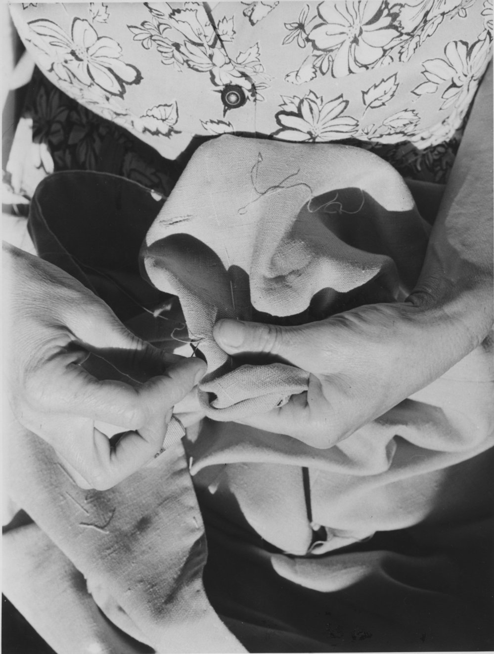 Hand-sewing buttonholes, 1950s