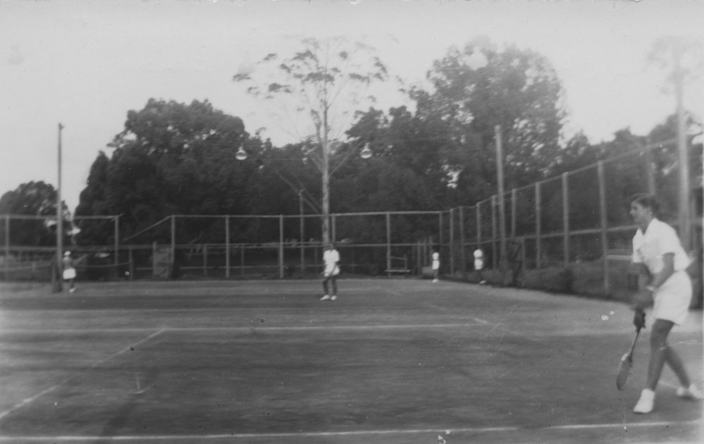 High School students playing tennis, 1950s 