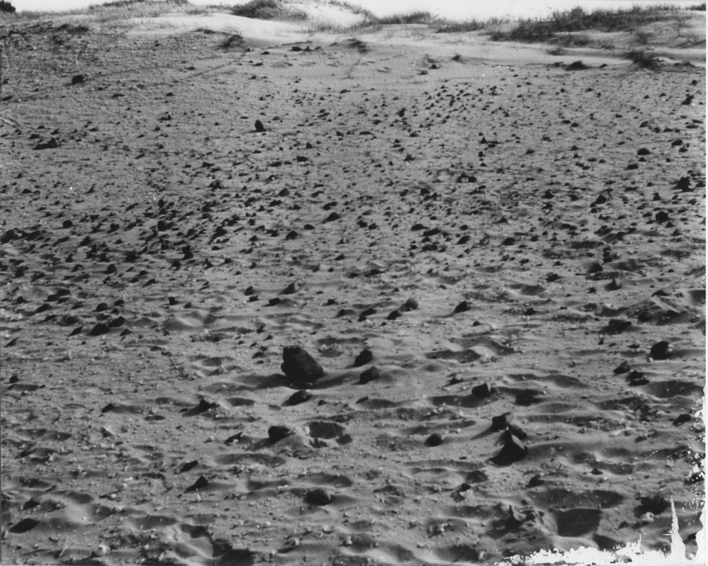 Implements and broken pebbles on midden and factory site 